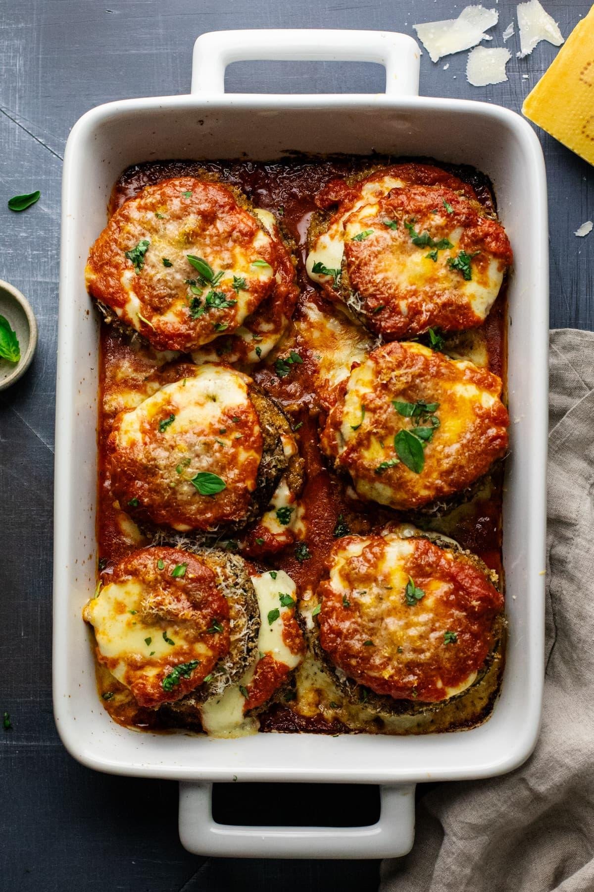 Concocting a mouth-watering roasted eggplant parmesan with Italian herbs